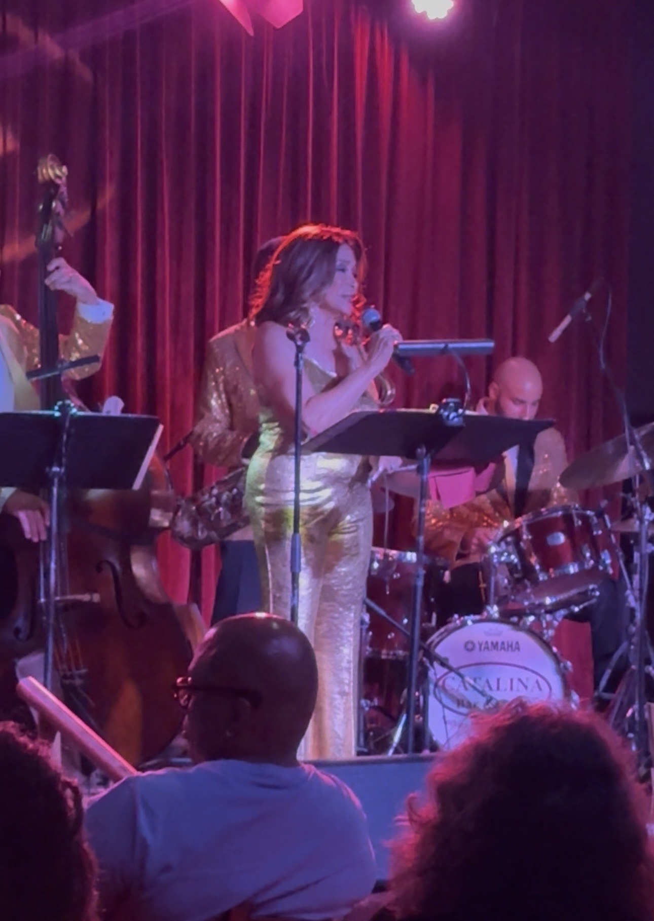 Freda Payne at the microphone with her band behind her in gold jackets, the Catalina Jazz Club bass drum head visible
